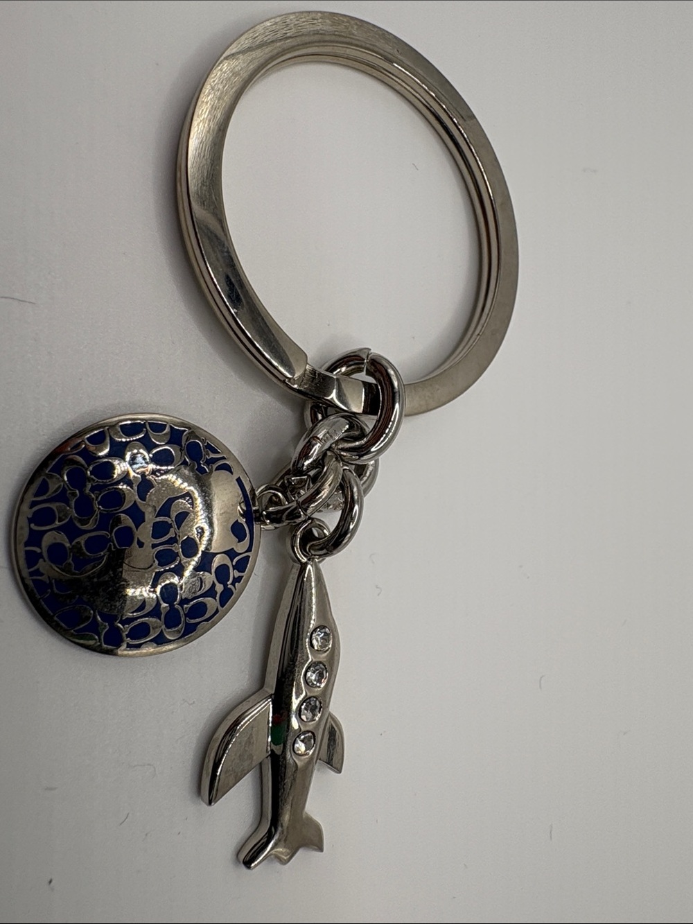 Coach Silver Airplane Keychain with Navy Enamel Glob Charm